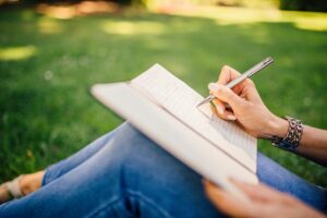 Woman journaling in nature