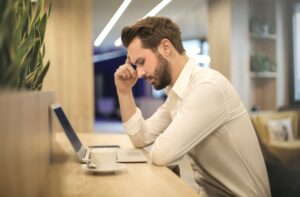 Anxious man at laptop