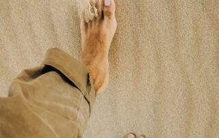 Man walking in sand