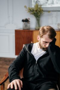 Sad man sitting in a chair