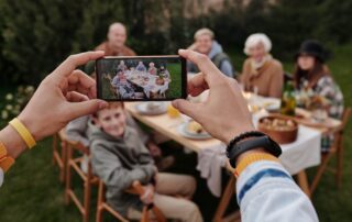 Multigenerational family sharing a meal outside