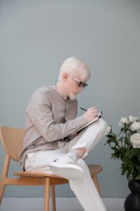 Man writing in a journal