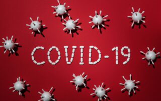 COVID-19 sign with virus models