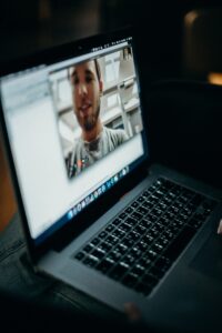 Man on screen in online meeting