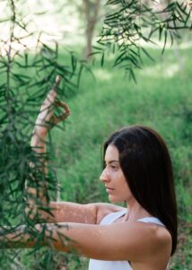 Woman outside in yoga pose