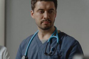 Man in Scrubs with Stethoscope Around Neck