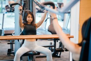 Woman working out on machine at gym