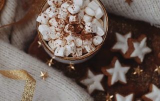 Holiday cocoa with marshmallows and a sweater