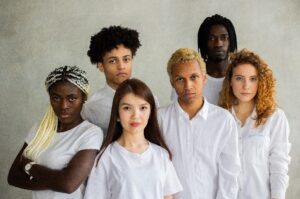 group of people in white shirts