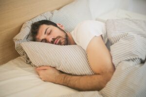 Man lying in bed sleeping